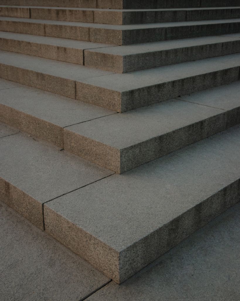 A geometric view of modern concrete steps featuring clean architectural lines.